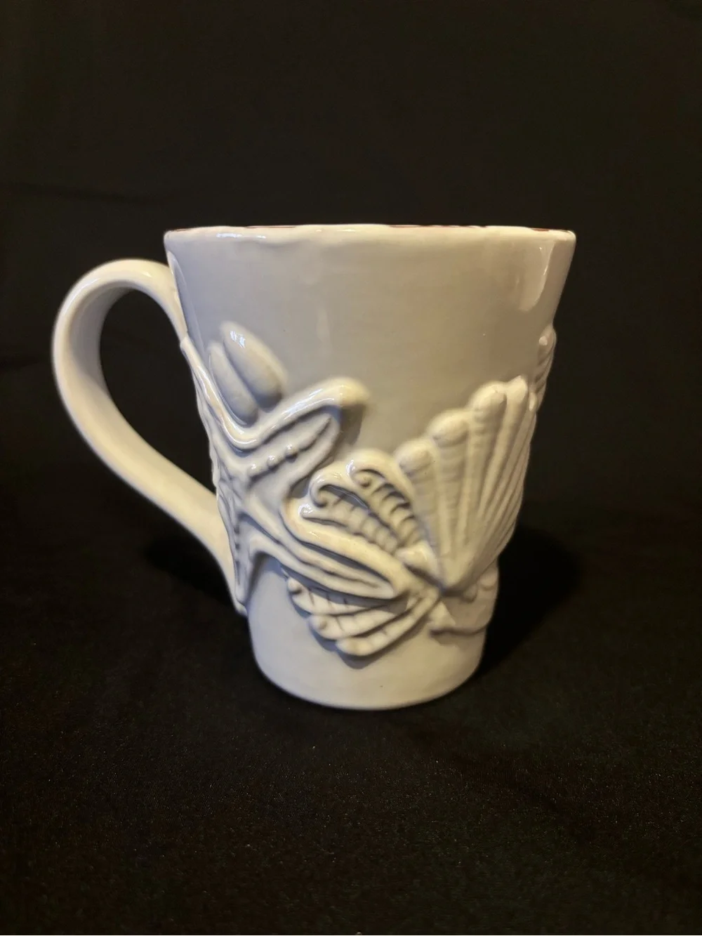Mud Pie Milk-Glazed Terracotta Embossed Coffee Mug. Seashell and Starfish